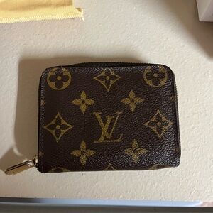 LV zippy coin purse.